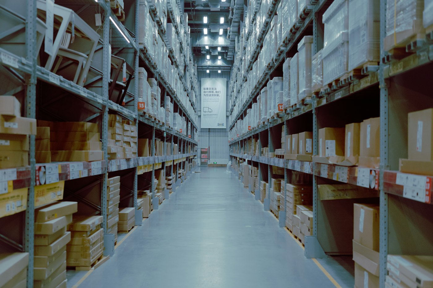Warehouse aisle with stocked shelving